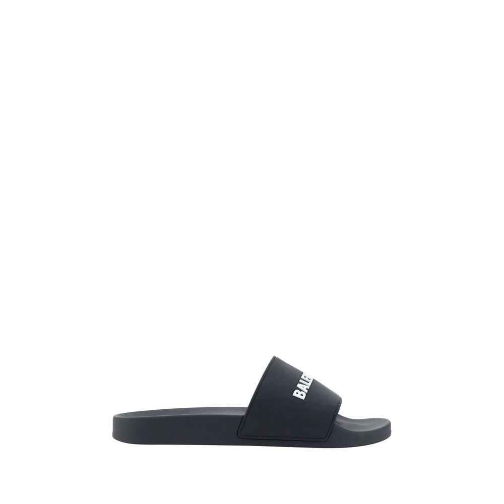 Black Balenciaga branded slide sandal with white logo on strap isolated on white