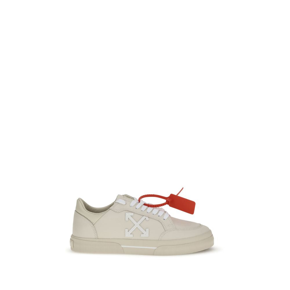 Off-white low-top sneaker with white arrows logo and red zip tie tag on white background