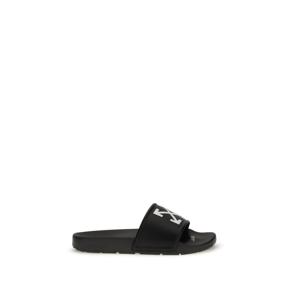 Black slide sandal with white arrow logo on strap and contoured footbed on white background