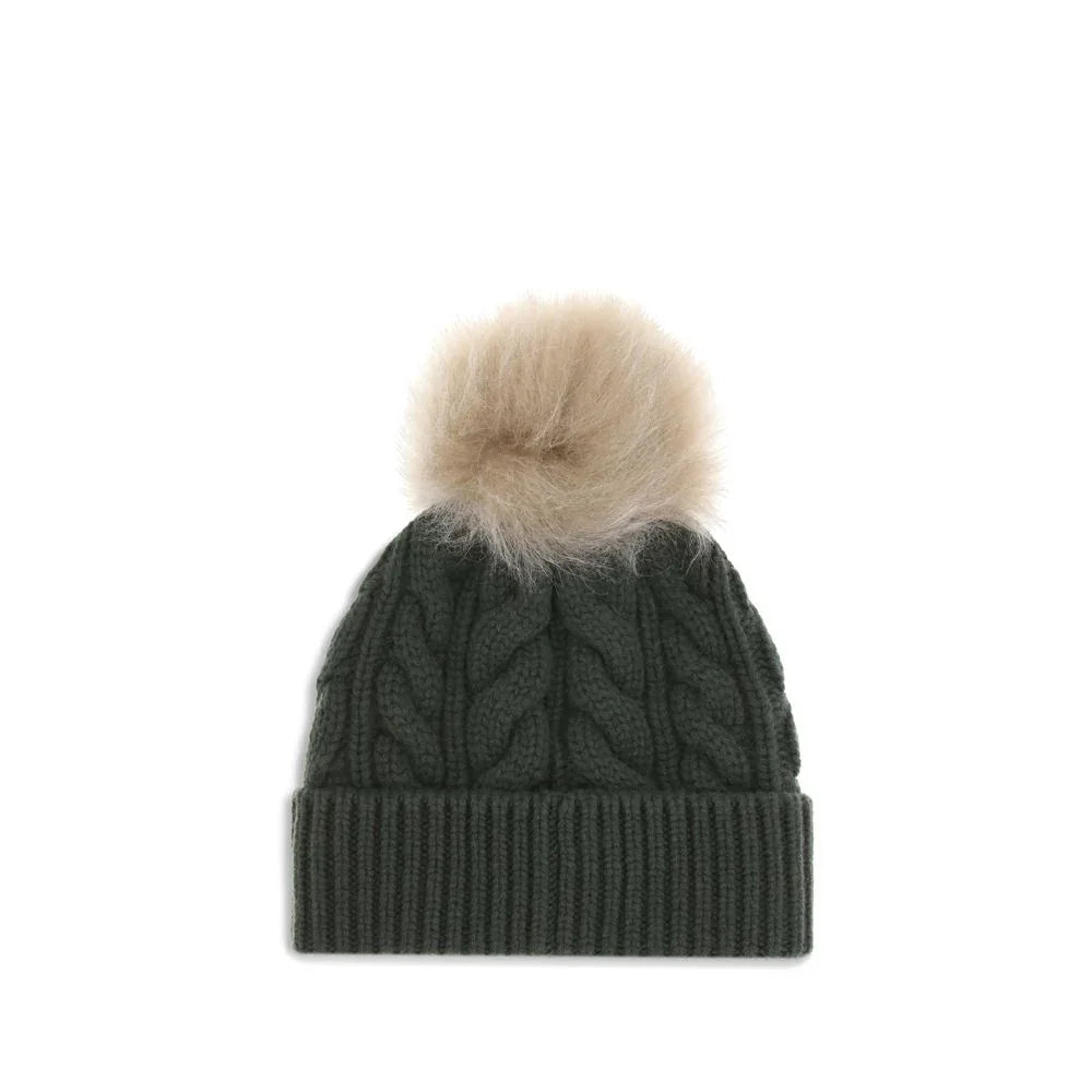 Dark green cable knit beanie with beige fur pom pom and small embroidered logo