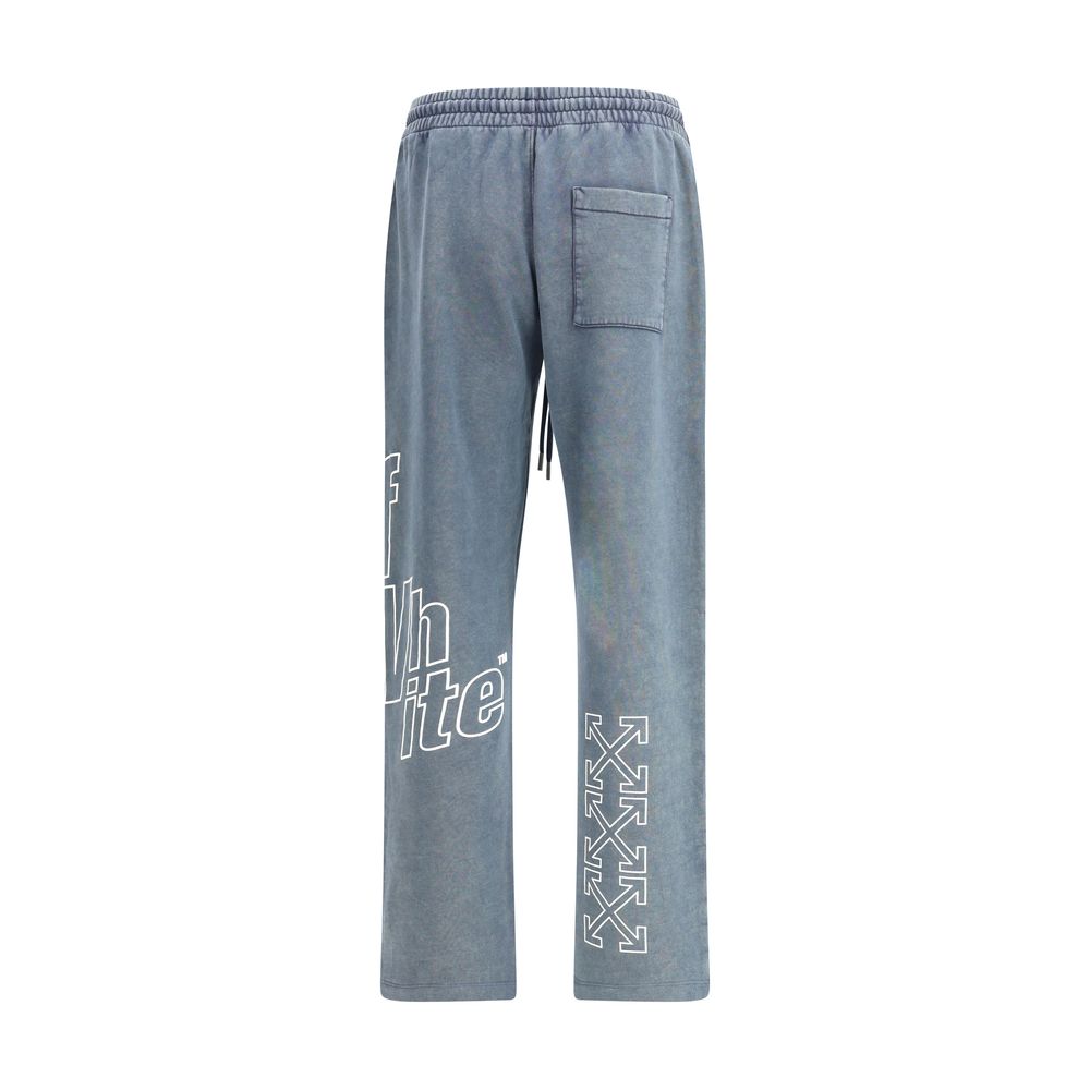 Blue washed jogger sweatpants with drawstring waist and white graphic text on left leg