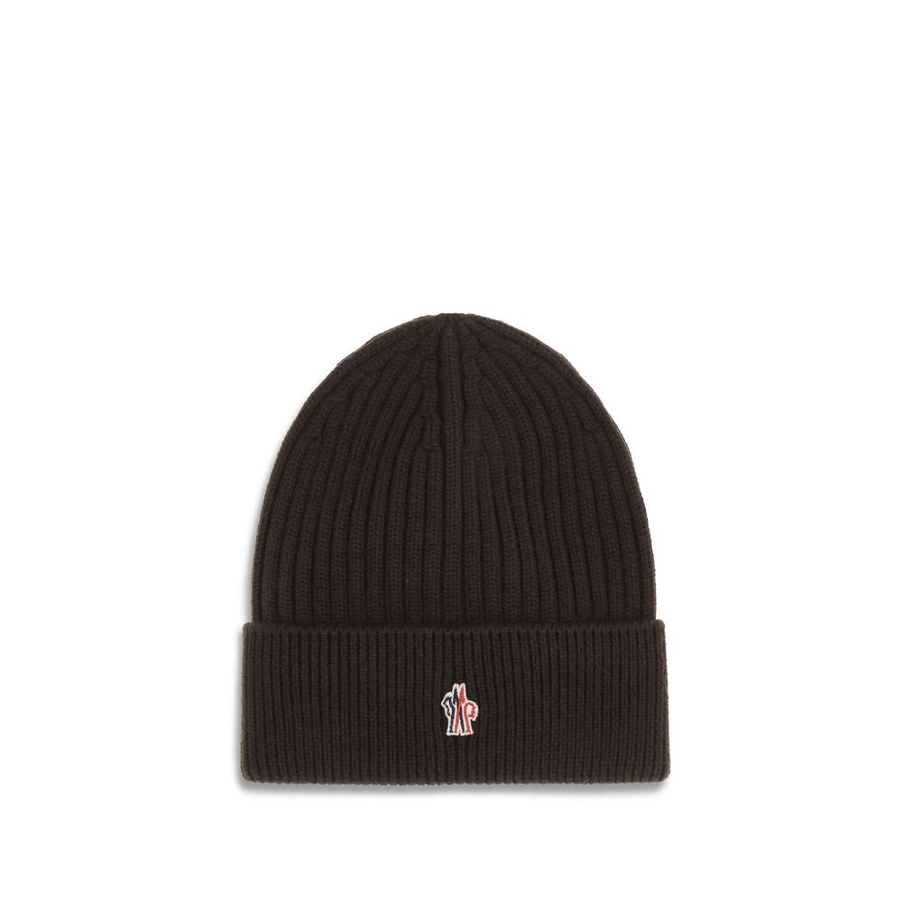Black ribbed knit beanie hat with folded cuff and small multicolor logo patch