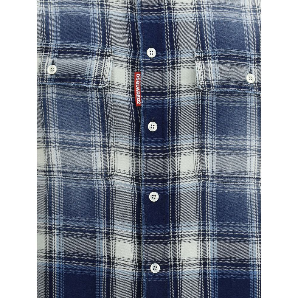 Close-up of blue and white plaid button-up shirt with chest pockets and Dsquared2 red logo tag