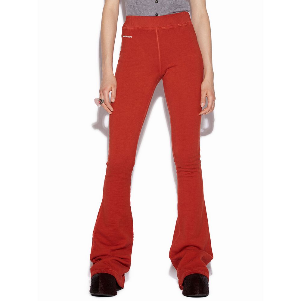Woman wearing red flared Dsquared2 pants with high waist and black platform shoes