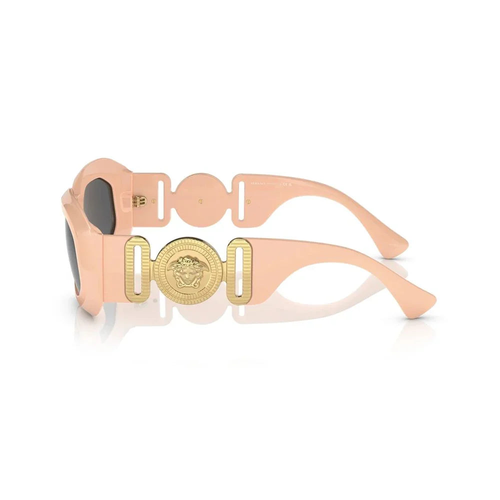 Pink designer sunglasses with gold Medusa emblem on the temple, luxury fashion eyewear
