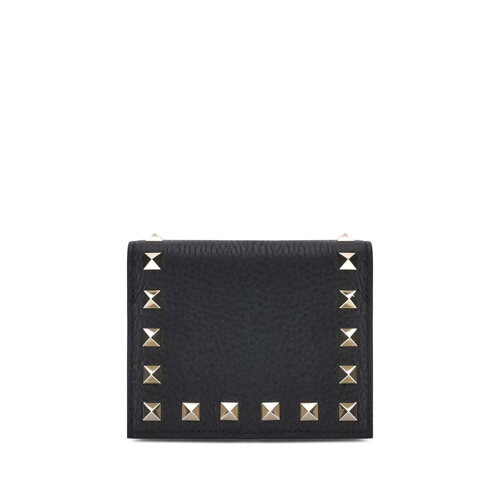 Black textured leather wallet with gold pyramid studs border on white background