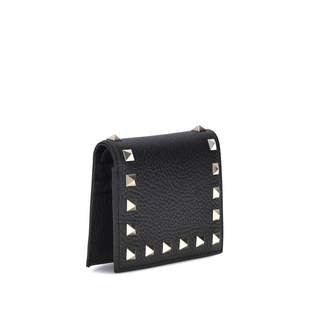 Black textured leather wallet with silver pyramid studs on front edges