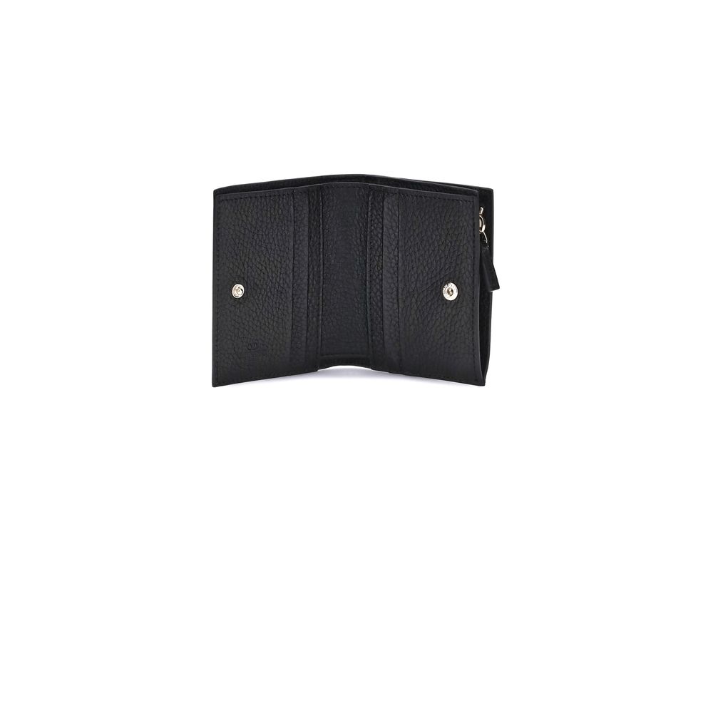 Black leather bifold wallet open showing textured finish and snap closures