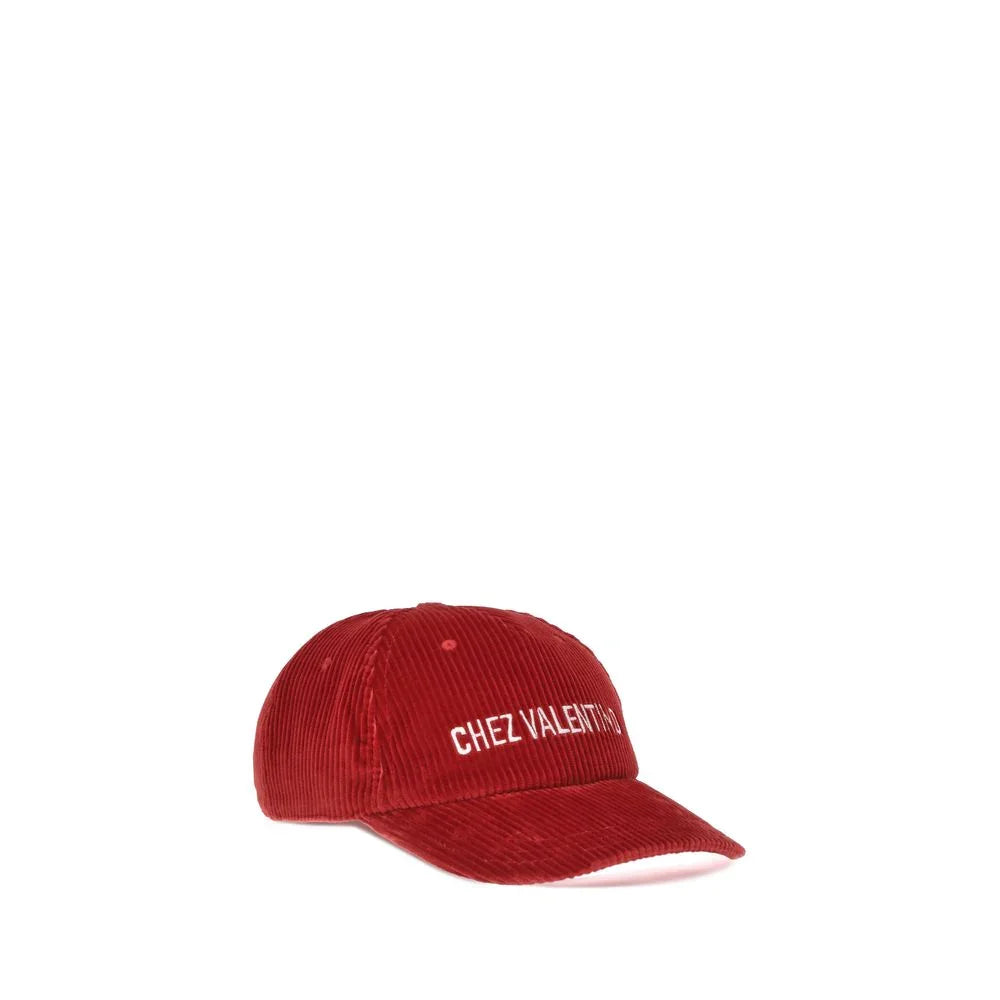 Red corduroy baseball cap with white Chez Valentino embroidered text