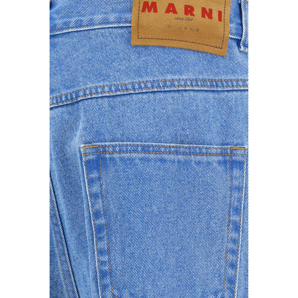 Close-up of light blue denim jeans back pocket with Marni leather brand label