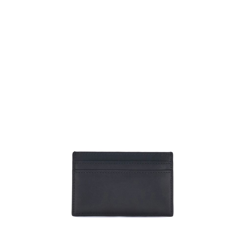 Black McQueen leather cardholder with white logo and multiple card slots