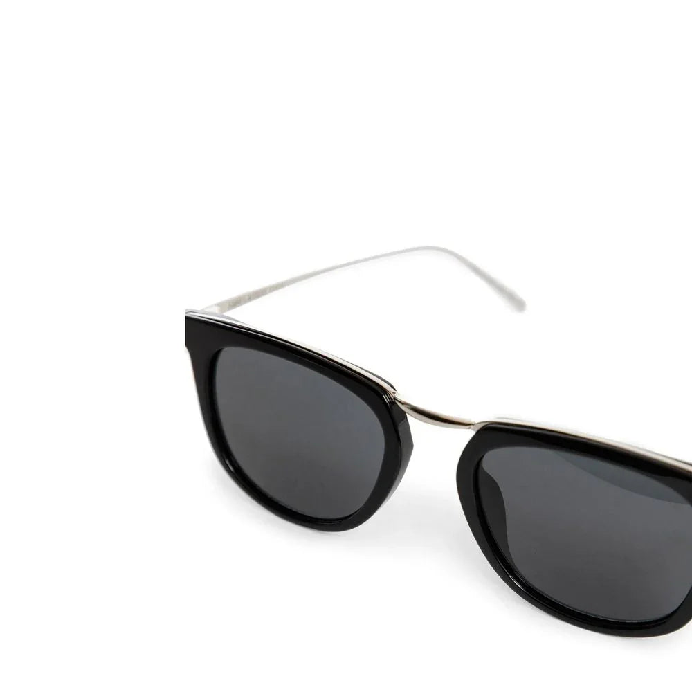 Black cat-eye sunglasses with dark lenses and thin silver metal arms on white background