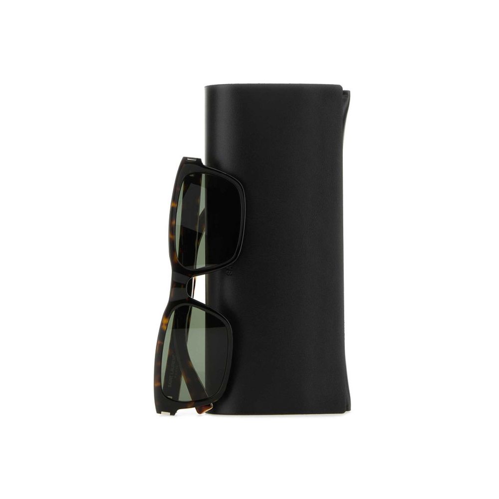 Tortoiseshell square sunglasses with dark lenses on a folded black leather case