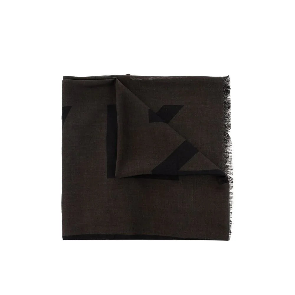 Folded dark brown scarf with subtle black geometric pattern and fringed edge on white background