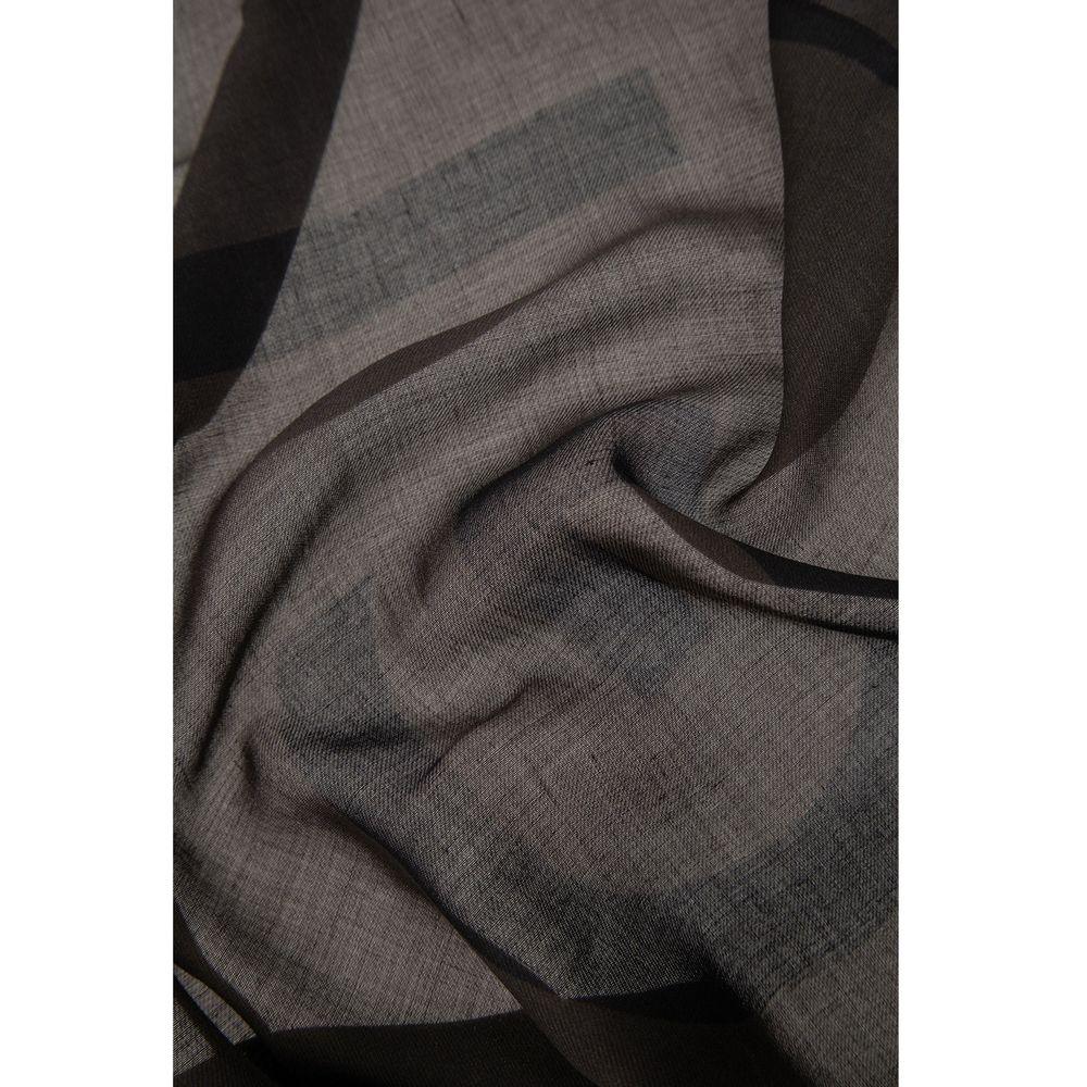 Close-up of soft, dark gray textured fabric with subtle folds and smooth draping