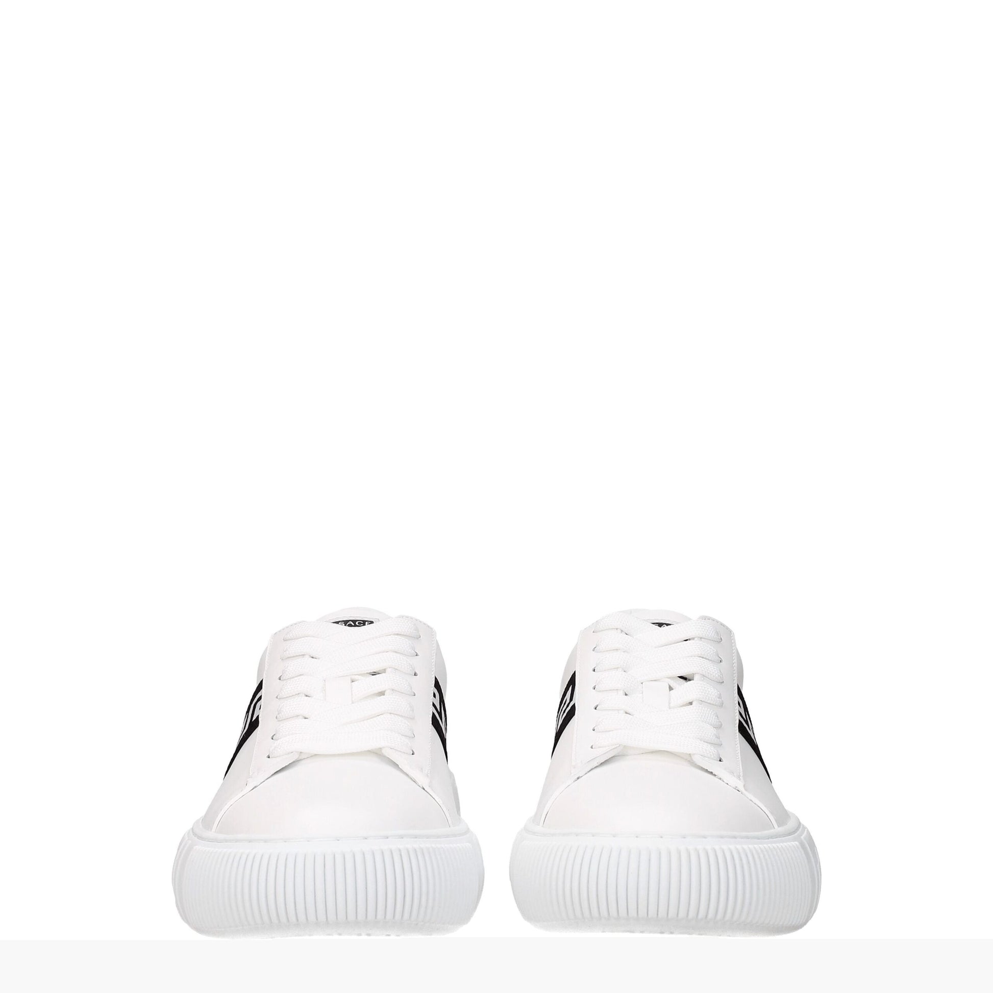 Pair of white sneakers with black side stripes and white laces, front view