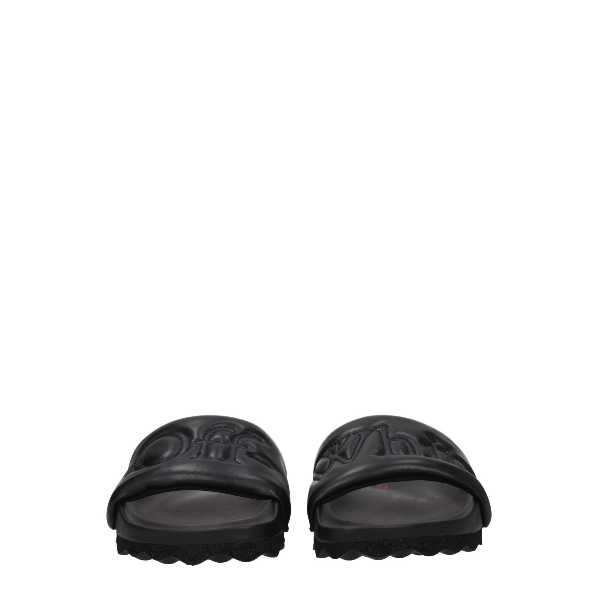 Black Off-White slides with embossed logo and textured sole, front view