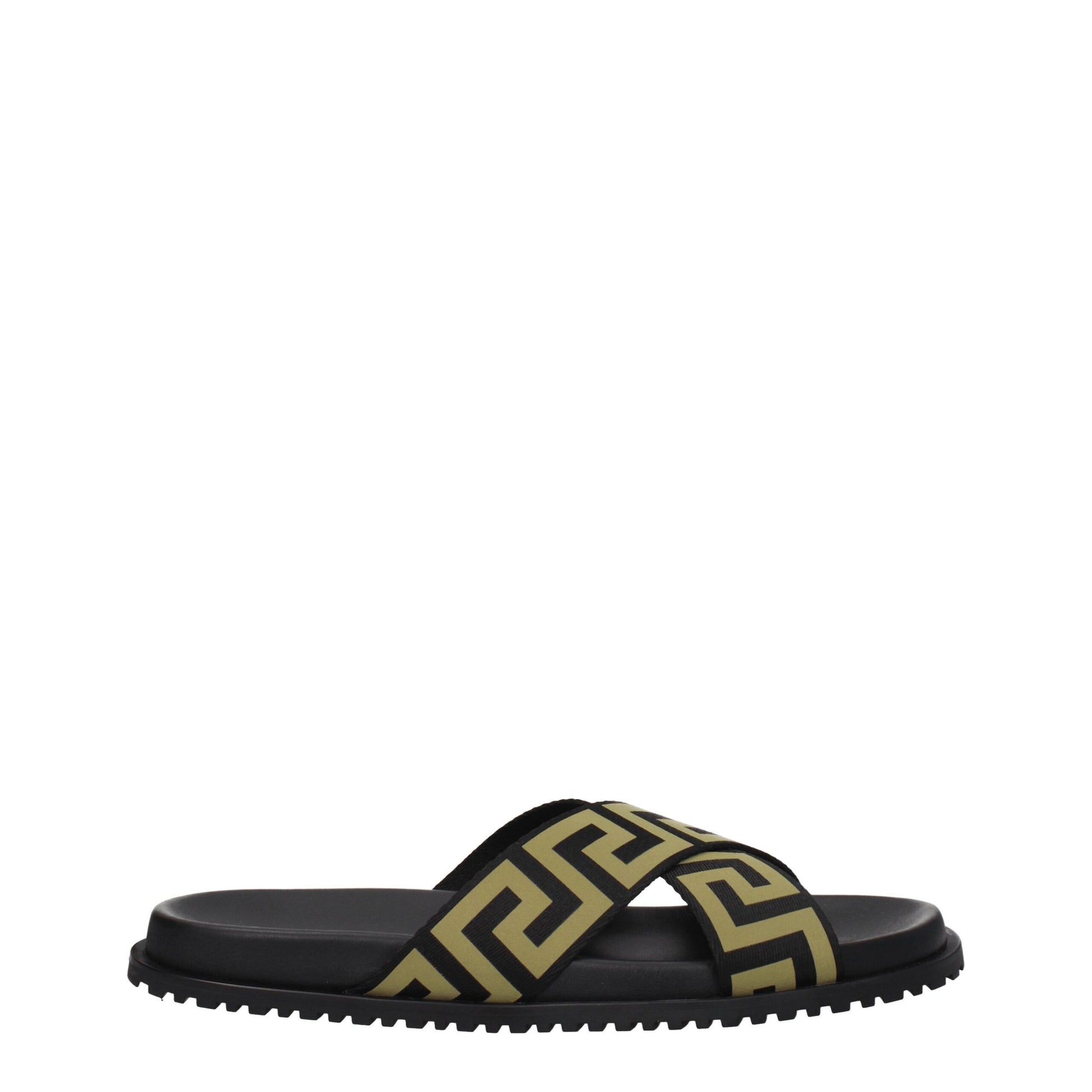 Black slide sandal with cross strap featuring gold Greek key pattern and rugged sole