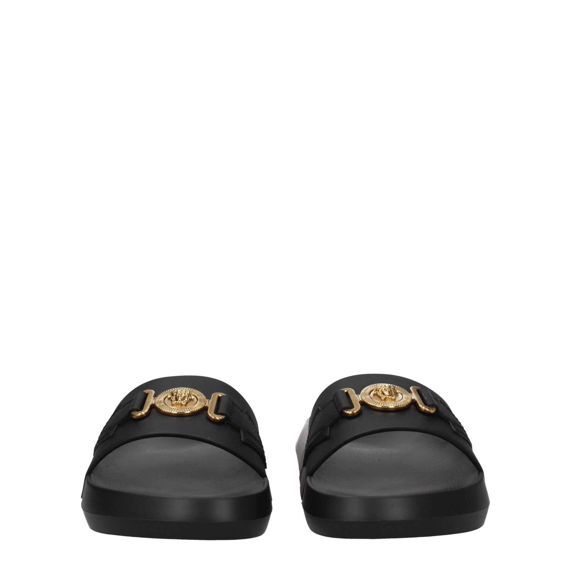 Black leather slides with gold emblem detail on straps, front view
