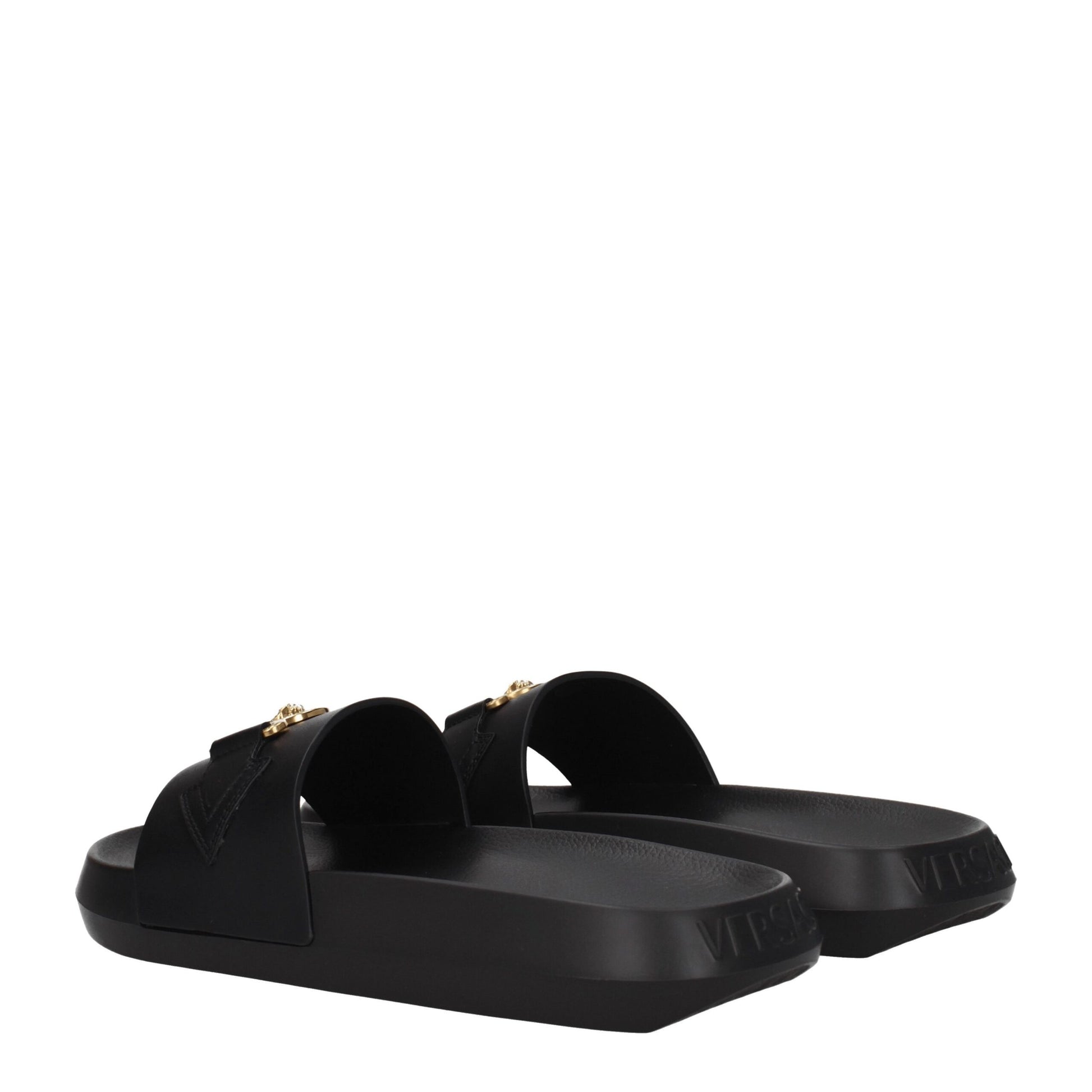 Black Versace slide sandals with gold Medusa emblem and embossed logo on thick sole