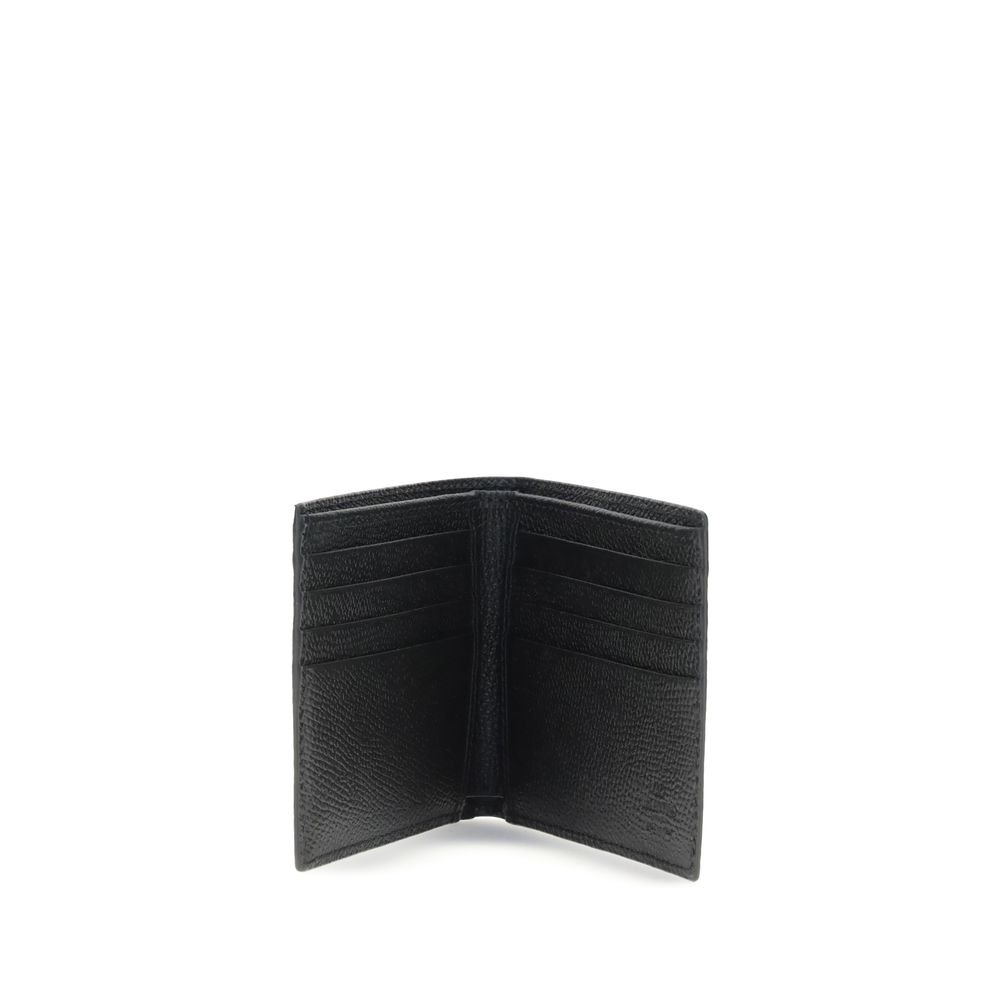 Open black leather wallet with multiple card slots on white background