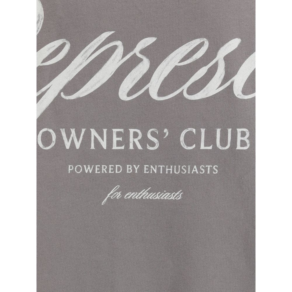 Close-up of gray fabric with white text reading Owners' Club powered by enthusiasts apparel