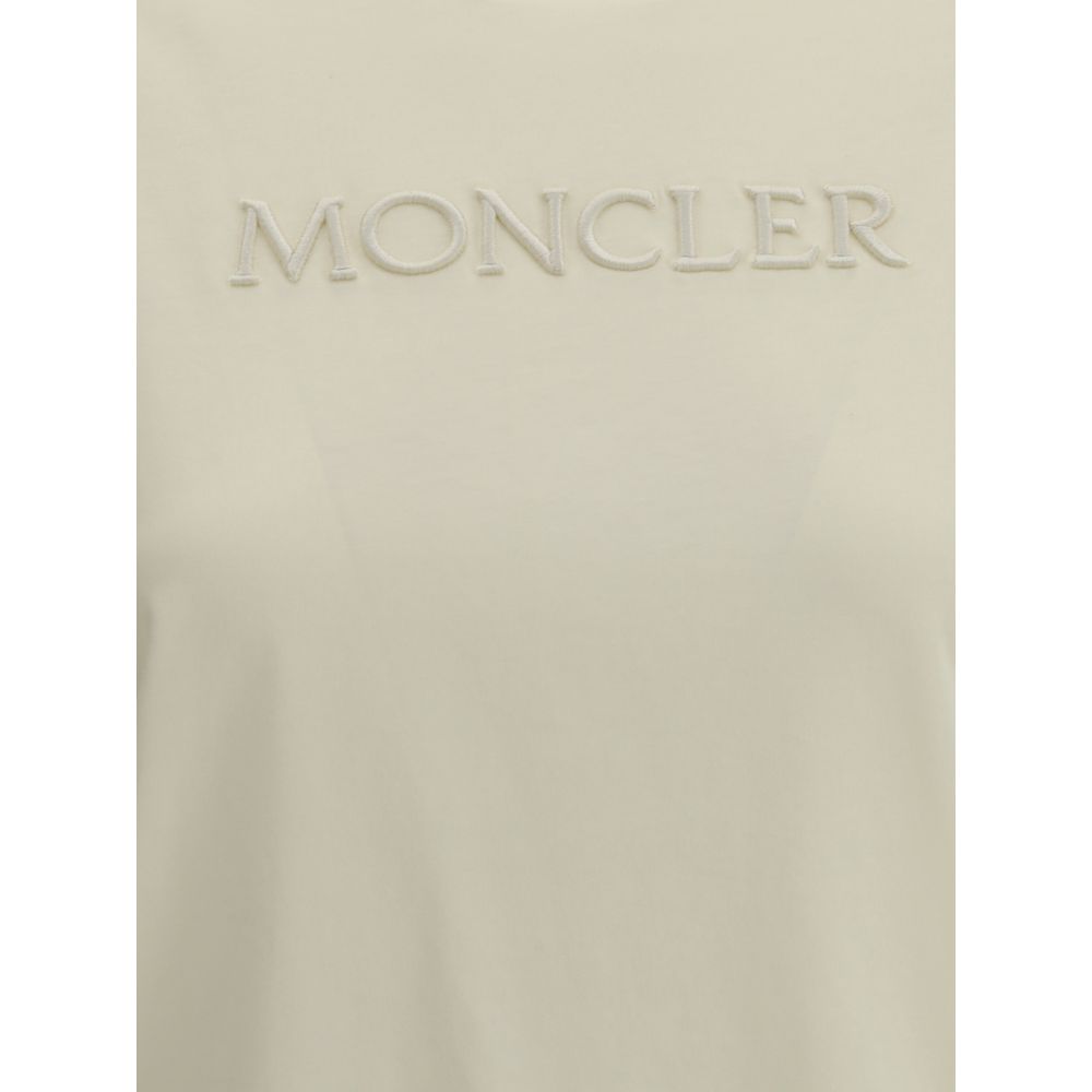 Close-up of beige Moncler T-shirt with branded embroidered logo on chest
