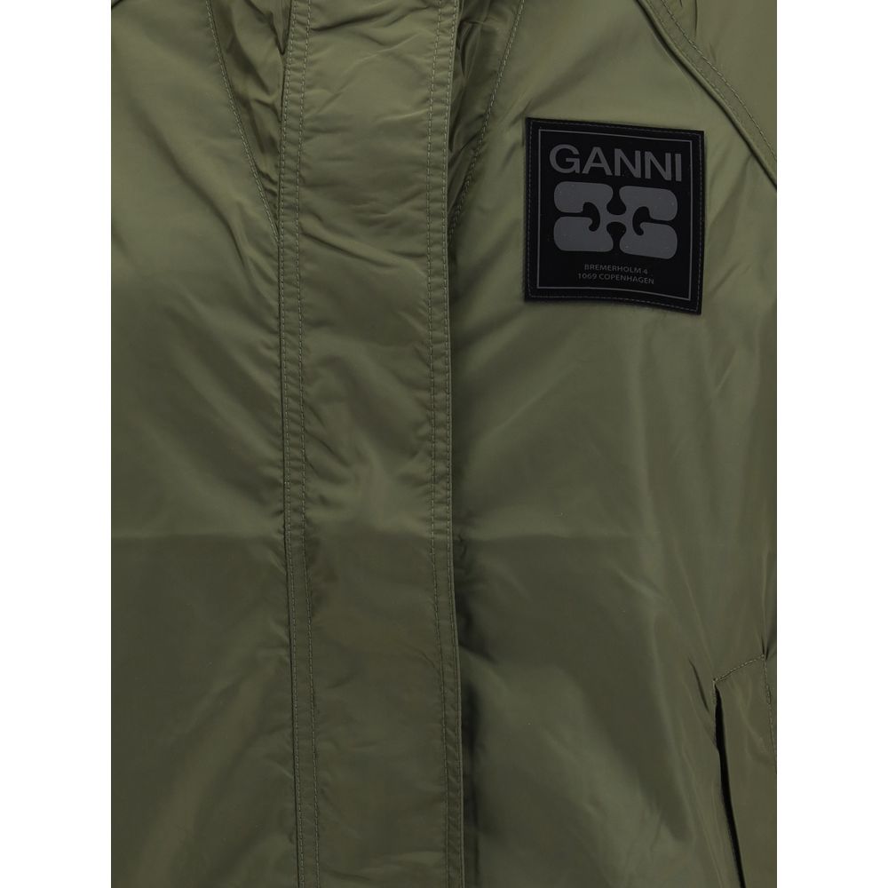 Close-up of olive green Ganni jacket with black logo patch featuring brand name and Copenhagen address