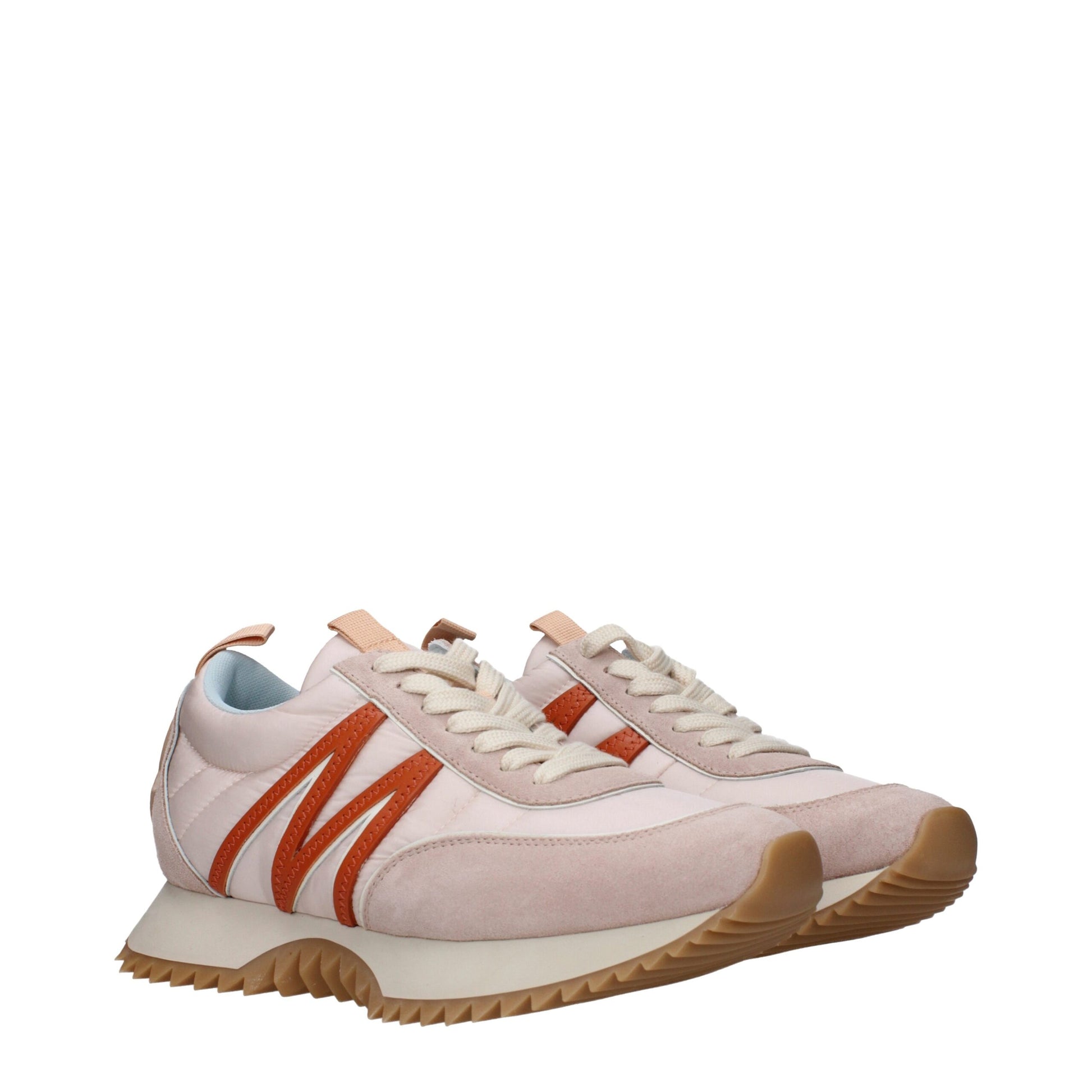 Beige and orange leather sneakers with white laces and gum soles on white background