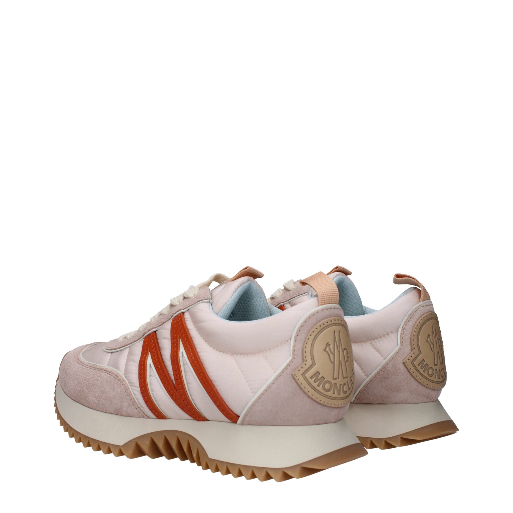 Moncler pink and beige sneakers with orange accents and textured gum sole side view