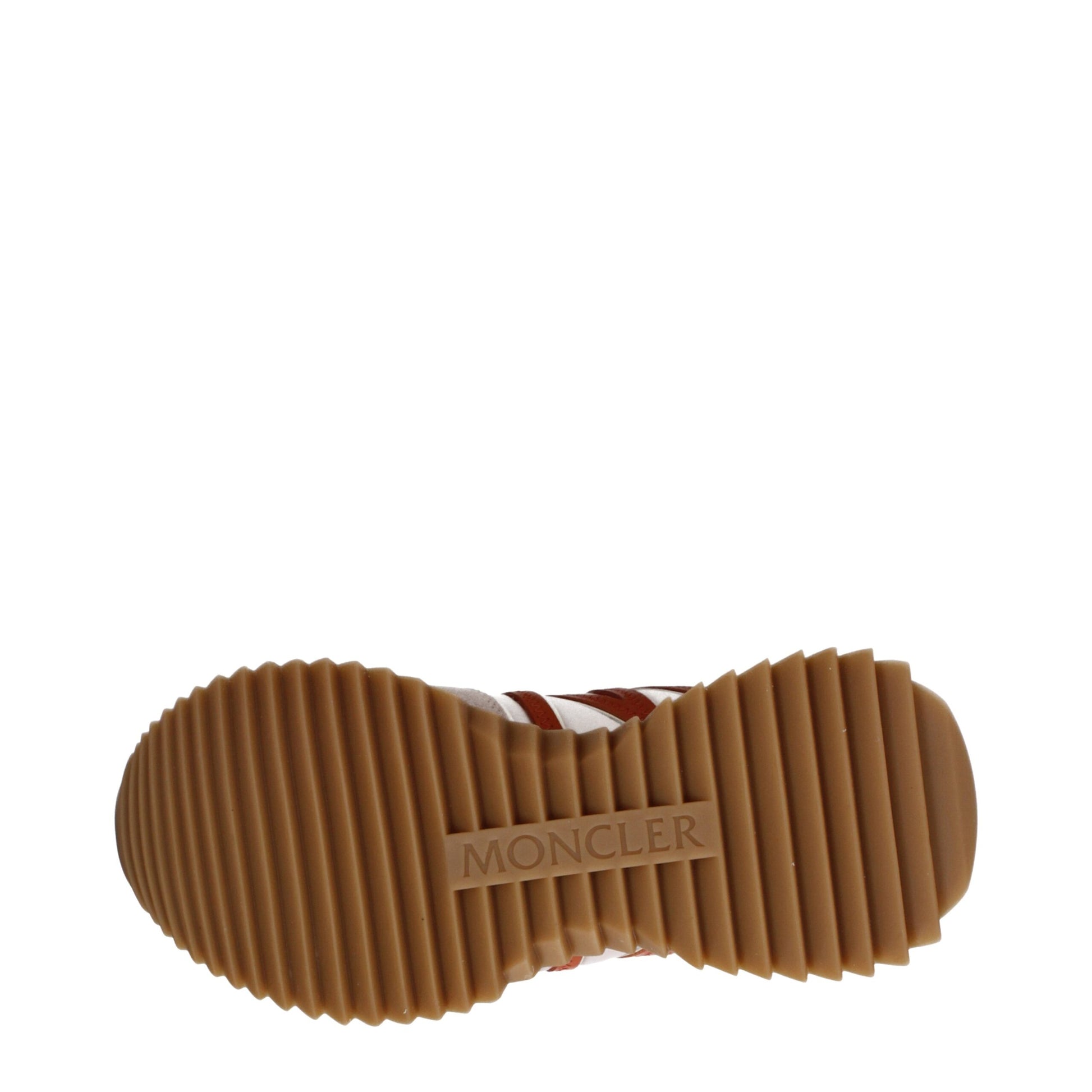 Brown Moncler shoe sole with ribbed pattern and Moncler logo embossed on rubber outsole