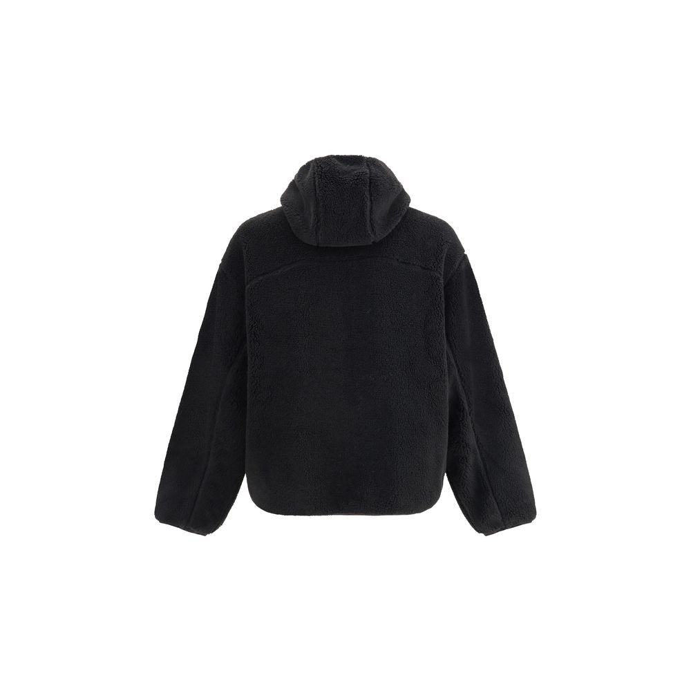 Black fuzzy fleece jacket with hood displayed from the back on white background