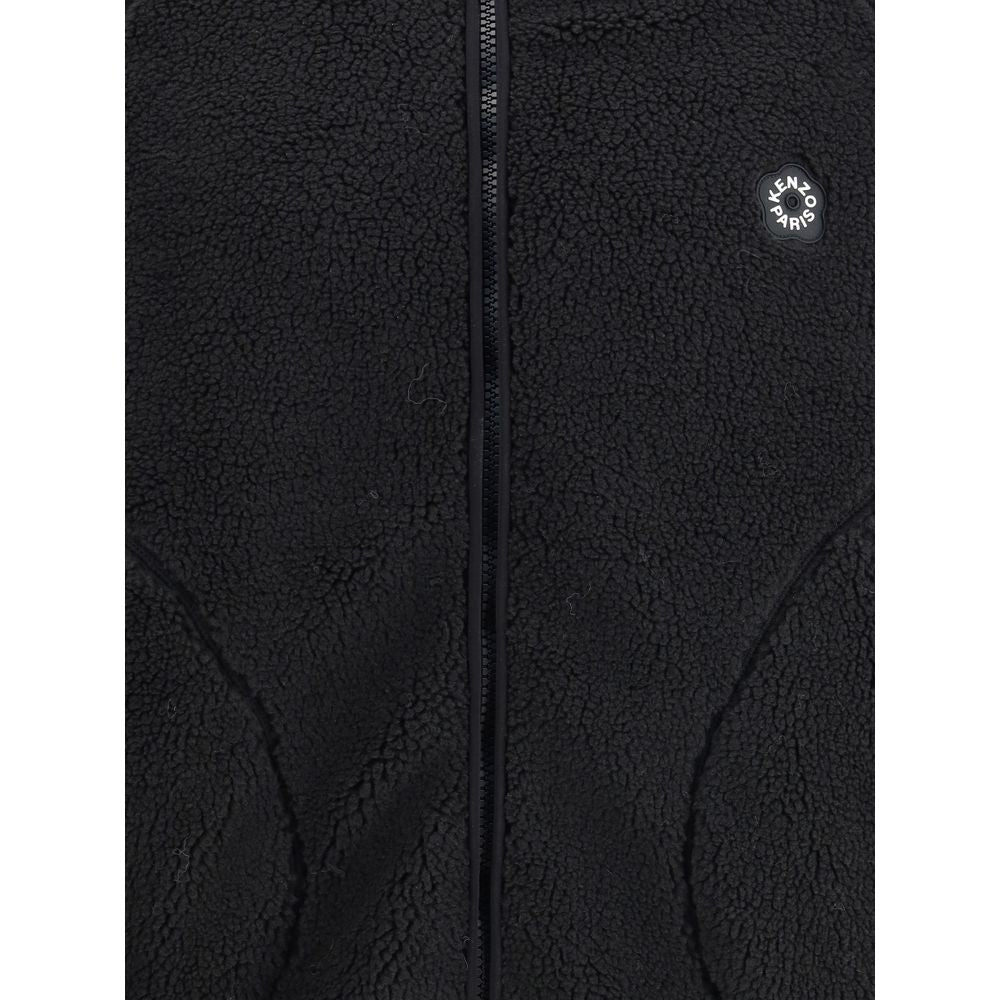 Close-up of black Kenzo Paris fleece jacket with zipper and textured fabric
