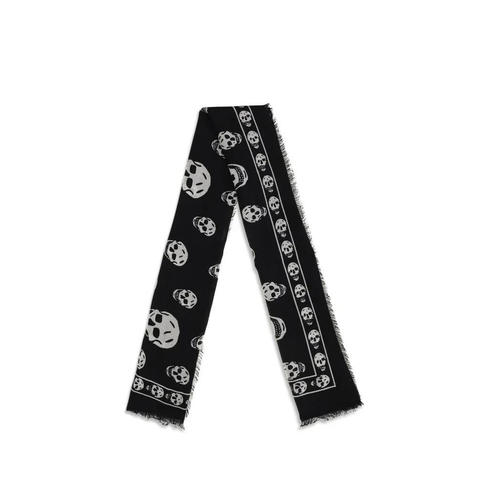 Black scarf with white skull pattern and frayed edges folded neatly