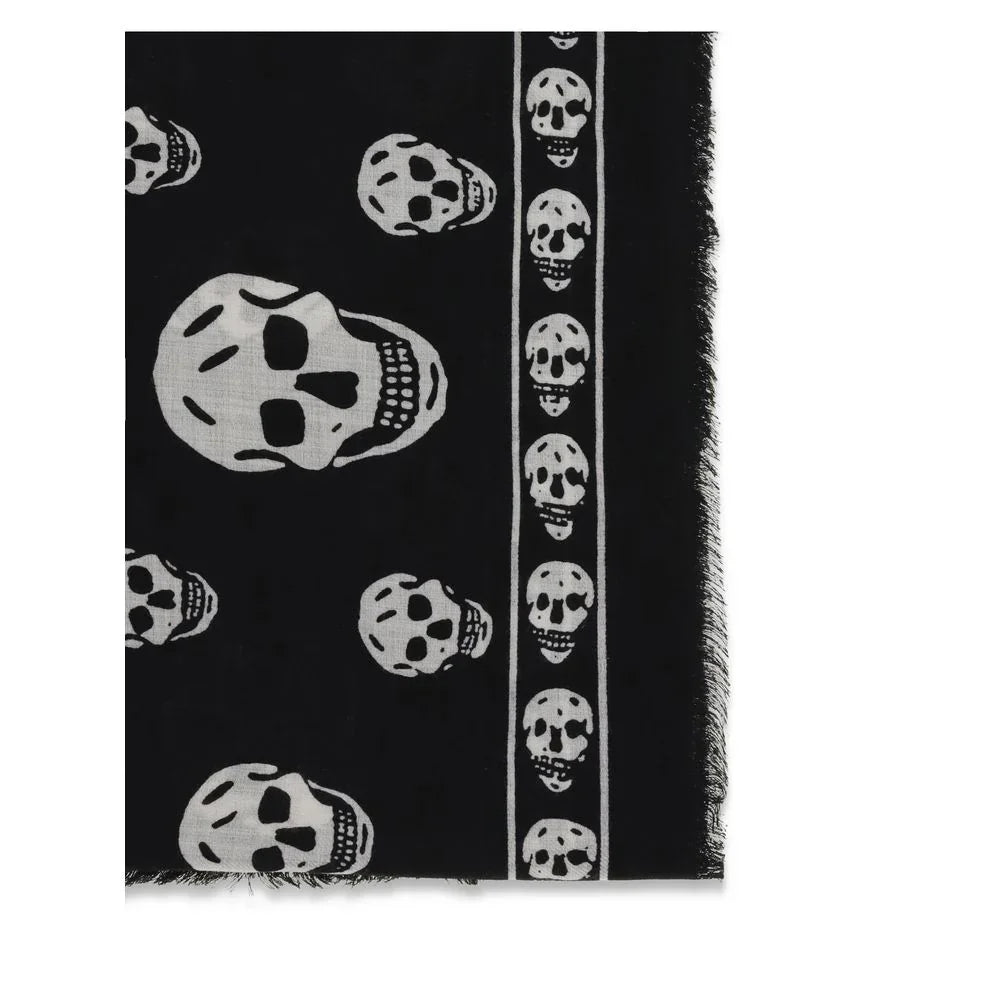Black scarf with repeating white skull pattern and frayed edges