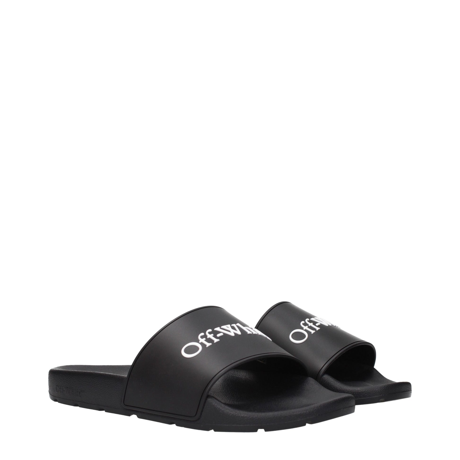 Black Off-White slide sandals with white logo strap on white background