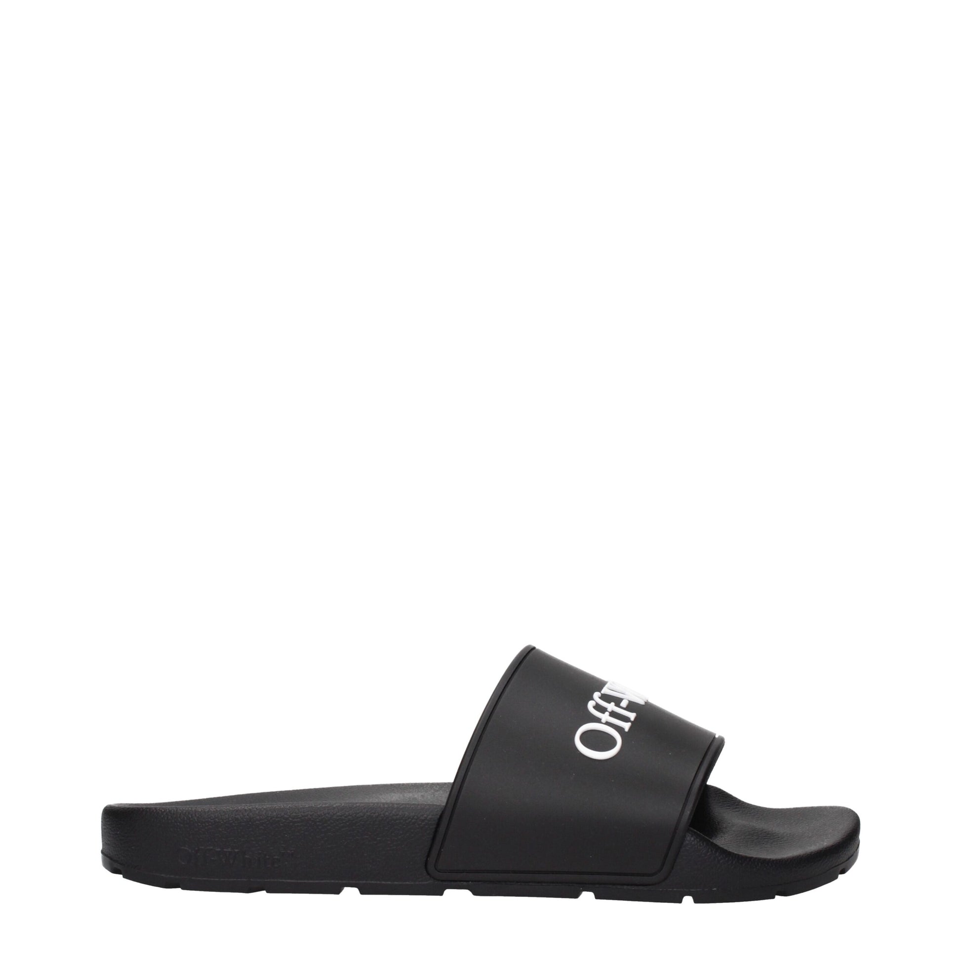 Black Off-White slide sandal with white logo on strap, cushioned sole, side view