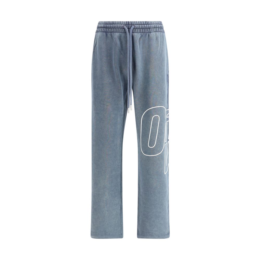 Blue washed jogger sweatpants with drawstring waist and white graphic text on left leg