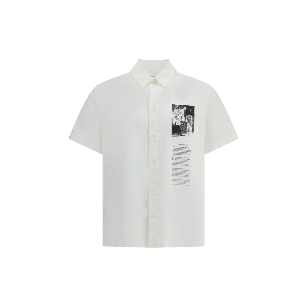 White short-sleeve button-up shirt with black and white text and graphic print on left chest