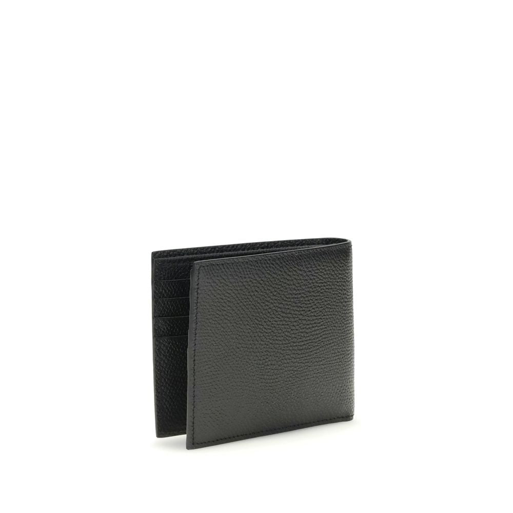 Black textured leather bifold wallet with multiple card slots isolated on white