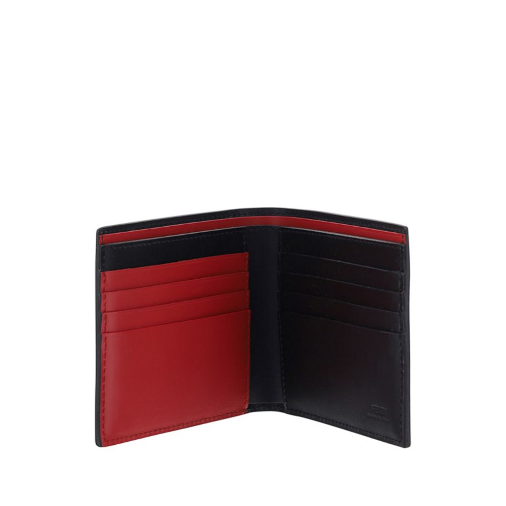 Open black and red leather bifold wallet with multiple card slots on white background