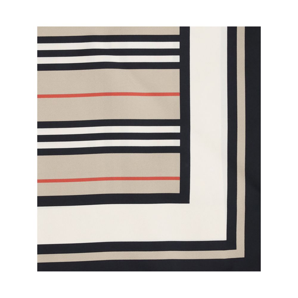 Close-up of fabric with beige, black, white, and red geometric striped pattern
