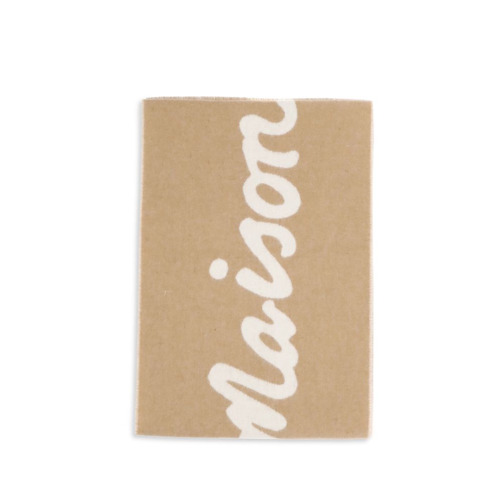 Beige blanket with white cursive text design on a white background