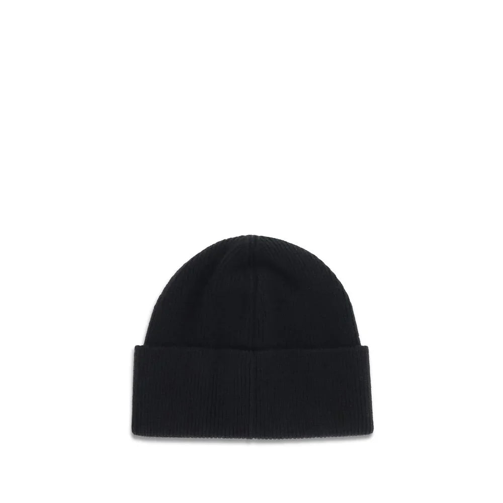 Black ribbed knit beanie hat with folded cuff on white background