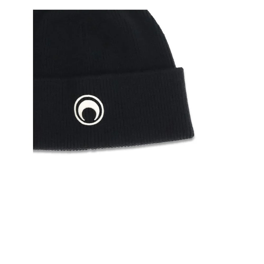 Black knit beanie hat with white circular emblem on cuff, minimalist winter accessory