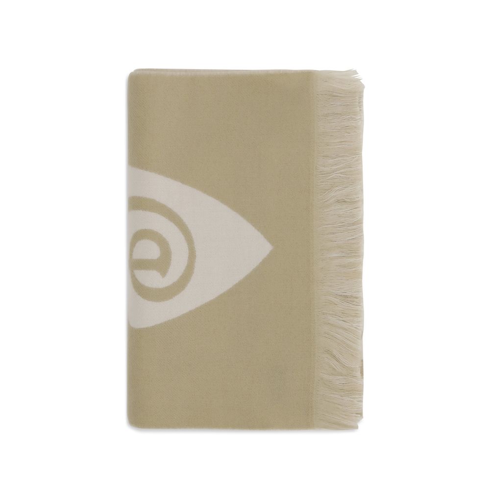 Beige woven blanket with white abstract swirl pattern and fringe edges