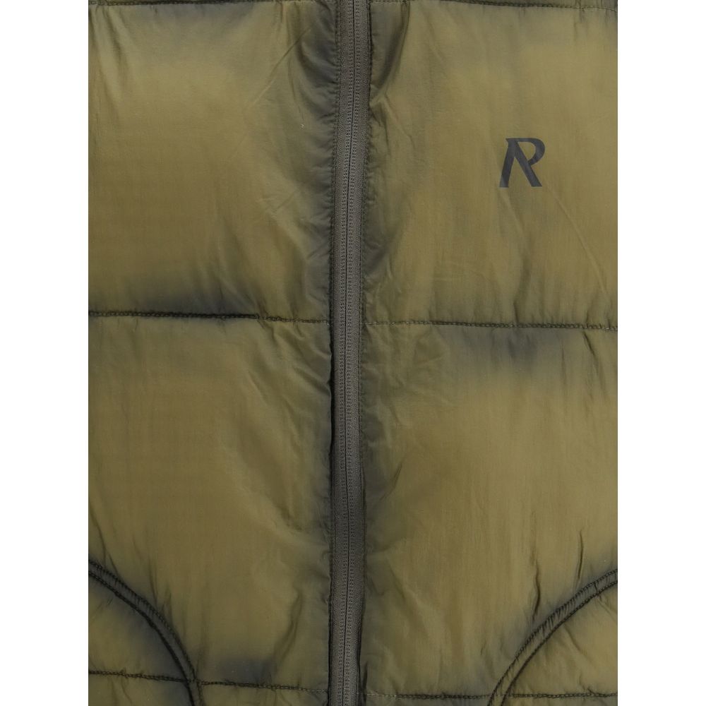 Close-up of olive green padded jacket with black zipper and small black R logo on chest