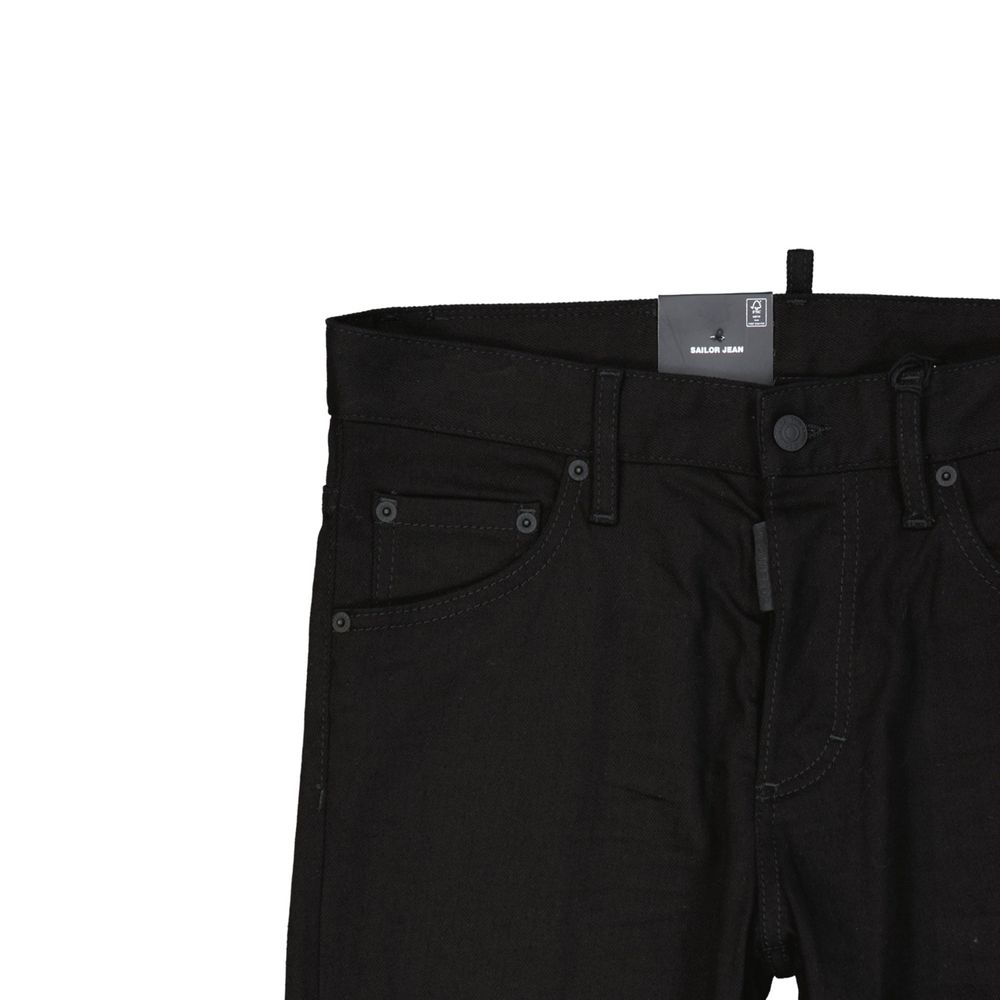 Close-up of black Sailor Jeans with front pockets and button closure on white background