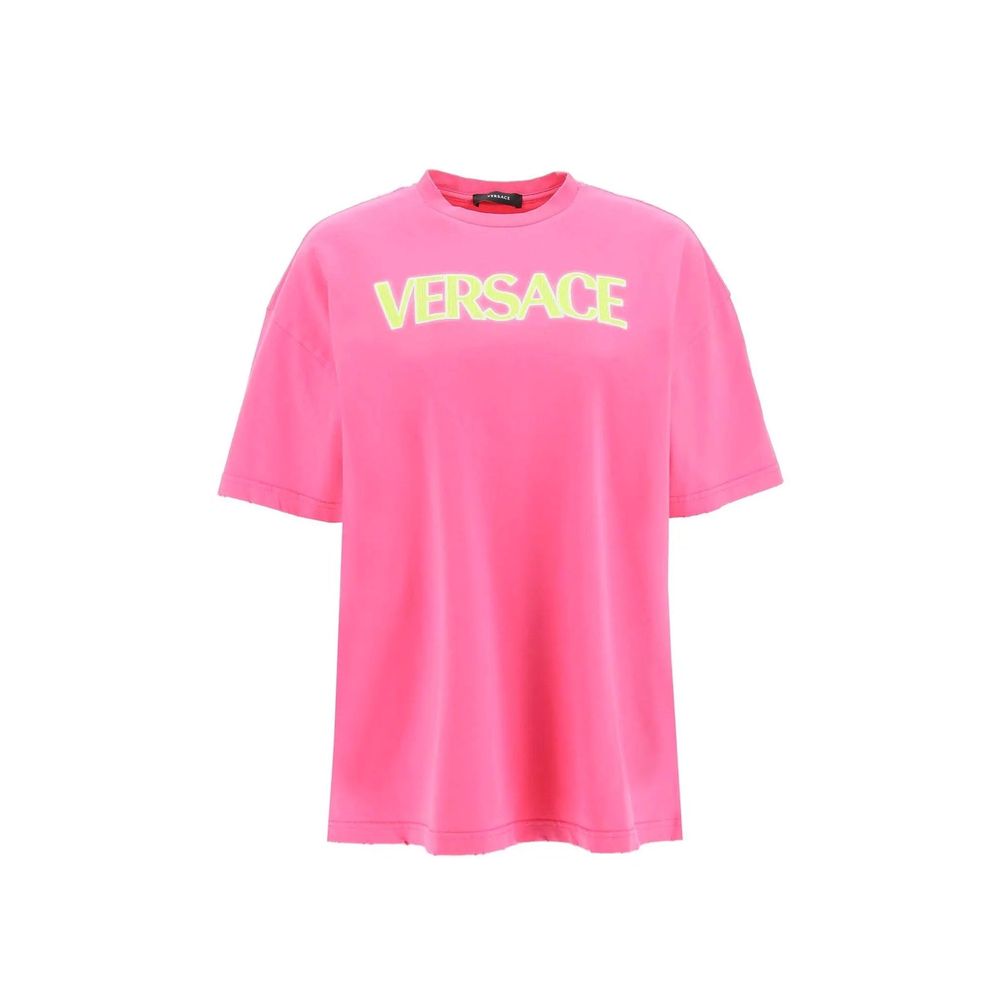 Pink Versace oversized t-shirt with yellow logo text on chest, short sleeves, crew neck