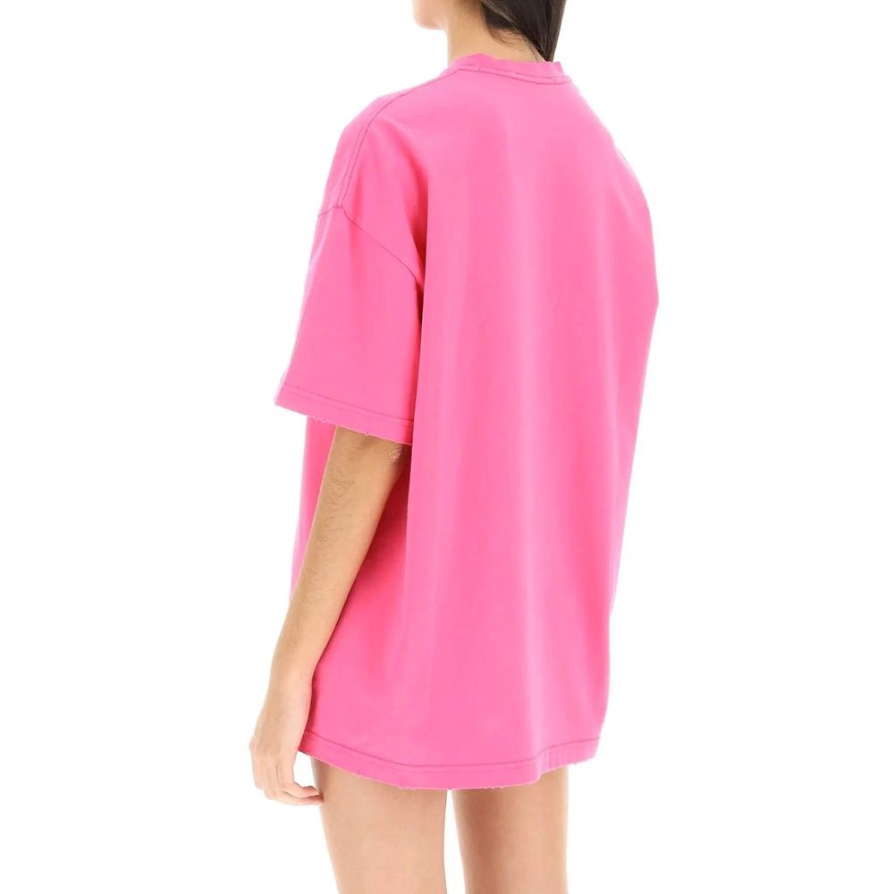 Back view of person wearing oversized bright pink short sleeve t-shirt on white background